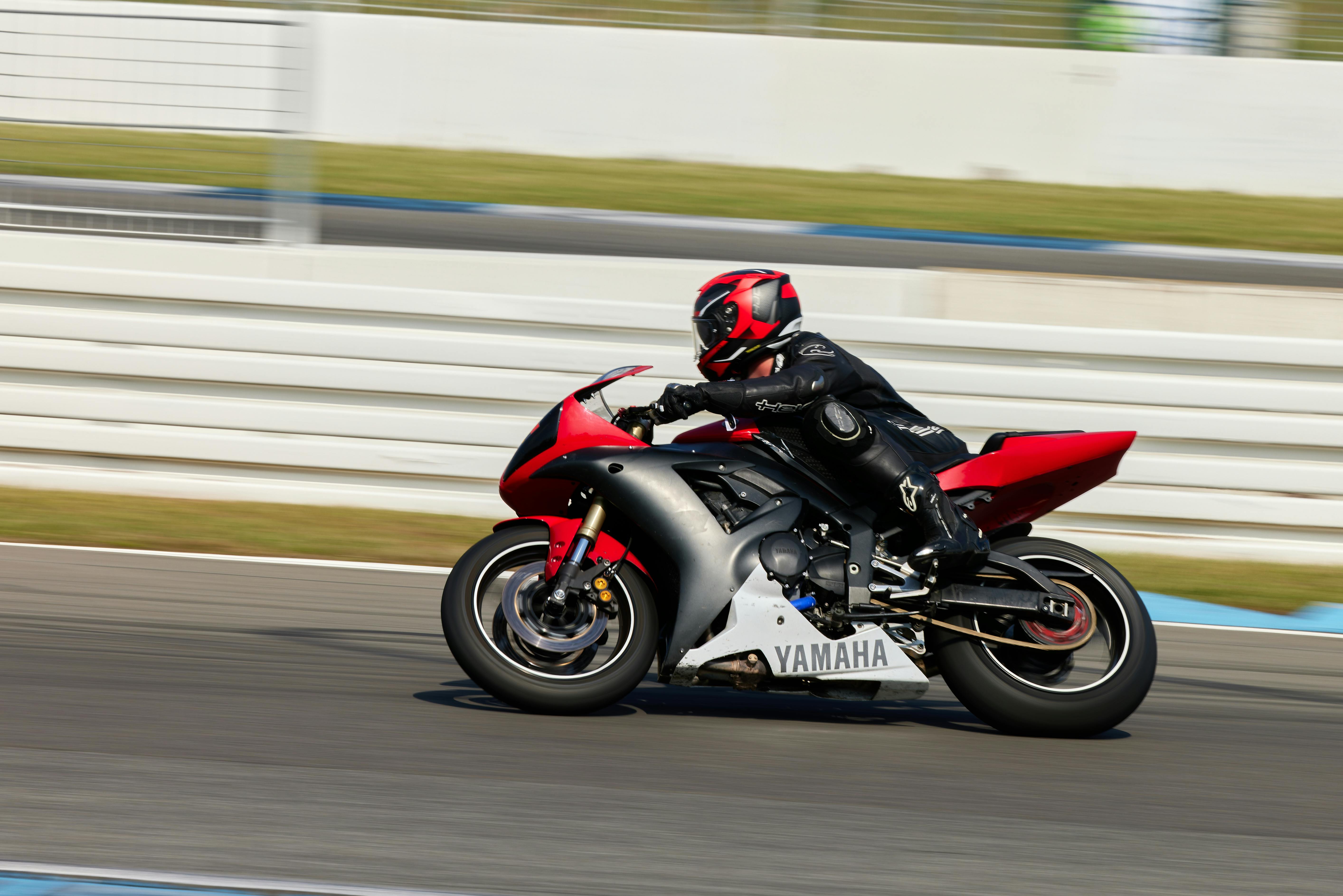 A motorcyclist in full gear speedily navigates the Hockenheim race track in Germany on a Yamaha bike.
